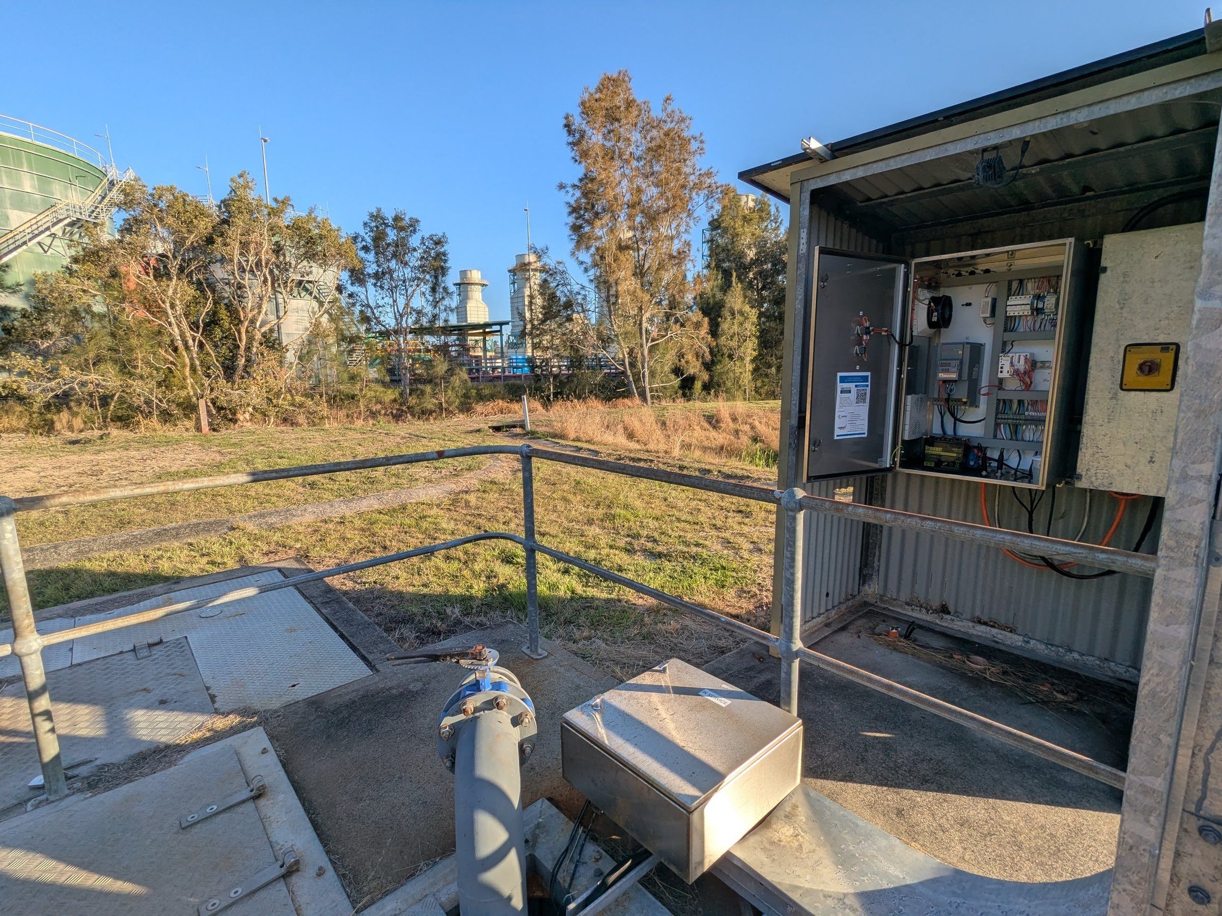 The open control panel at a stormwater pump station beside an 8 ML dam